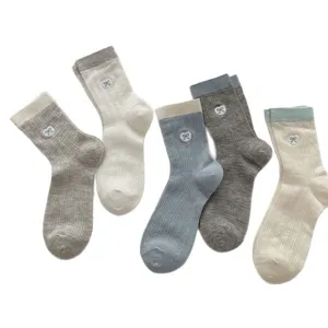 Women breathable mesh mid-tube socks with cute heart bow embroidery and color block design.