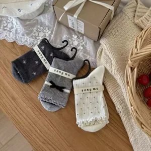 Cute bow crew socks for women, stylish knit cotton hosiery with sweet ruffles and dots.
