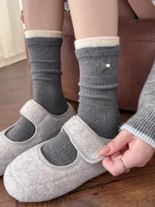 Winter cashmere socks with pearl bow, cozy double rib mid-tube design, soft detail view.