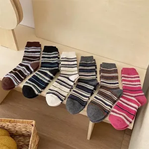Detail shot of vintage multi-color striped fuzzy mid-tube socks, soft autumn and winter wear.