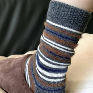 Detailed view of retro mocha colorblock striped mid-tube socks, fluffy warm winter wear.