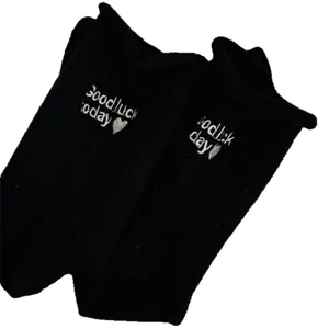 Thickened cashmere winter socks with loose rolled cuff and sweet embroidered letters.