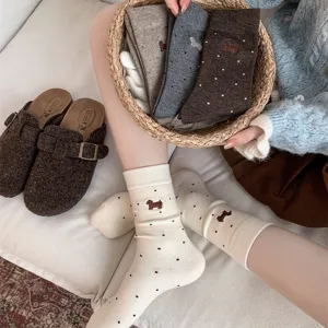 Women's cashmere wool mid-tube socks featuring cute dachshund embroidery and sweet polka dots.
