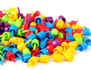 Colorful plastic mushroom pegs detail close up for creative mosaic peg board children toys