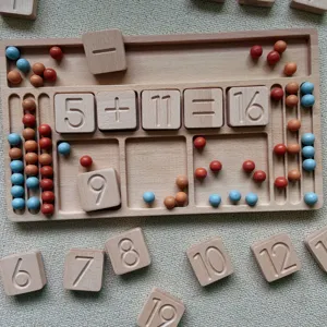Wooden montessori math counting board with engraved numbers and colorful balls for early education.