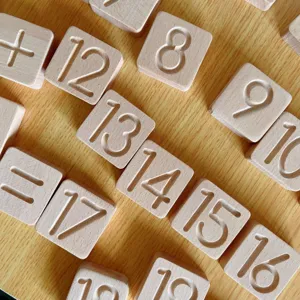 Close-up detail of wooden number blocks for early education, natural wood grain texture.