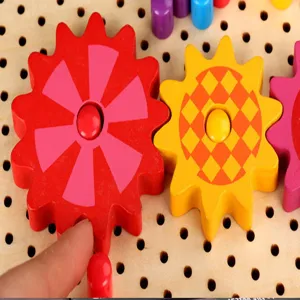Close-up detail of colorful wooden gear puzzle pegs toy, showing fine craftsmanship and texture.