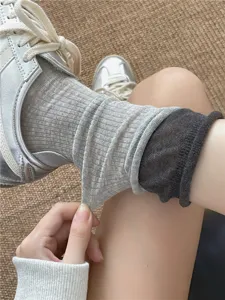Detailed view of sheer summer layered socks with rolled cuffs, showcasing breathable ribbed texture.