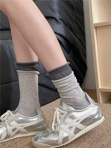 Grey layered mid-tube socks with rolled edge and breathable ribbed texture detail shot.