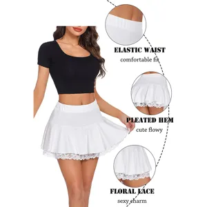 Detail view showing elastic waist, pleated hem and floral lace features of the white mini skirt.