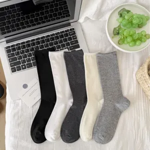 Women solid color long slouch socks, versatile basic cotton calf socks for daily wear.