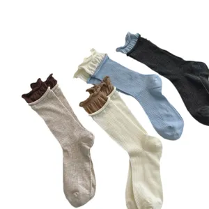 Women's stylish crew socks with cute ruffled cuffs, breathable knitted daily wear.