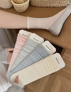 Summer thin breathable mesh women socks in various solid colors with cute design detail.