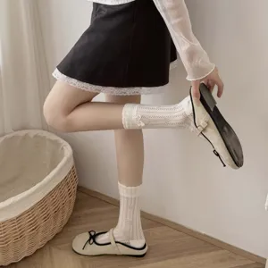 Cream hollow diamond floral college style women's mid-tube socks for spring and summer.