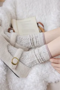 Cozy women's thick wool knit slouch socks in winter Maillard style, warm detail view.