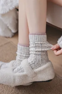 Cozy winter wool blend slouch socks detail shot, soft thick speckled knit texture for women.
