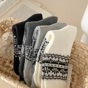 Detailed view of vintage Fair Isle knit socks in assorted colors, cozy winter hosiery.