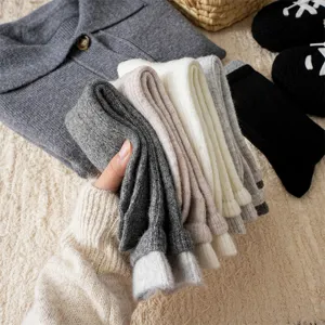 Detailed shot of cozy thick wool blend winter slouch socks in multiple colors for women.