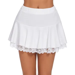 Close-up detail shot of white pleated mini skirt featuring delicate lace hem trim and elastic waist.