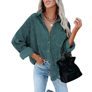 Detail of women's corduroy long sleeve button down shirt featuring classic lapel and handy pocket.