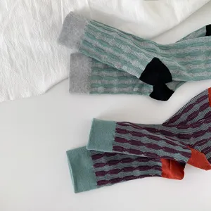 Vintage style women cotton mid-tube socks featuring contrast color design and knit relief texture.
