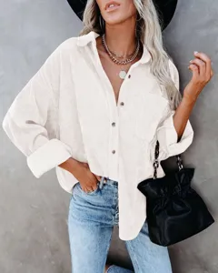 Detailed view of women's casual corduroy long sleeve shirt with lapel and button front.