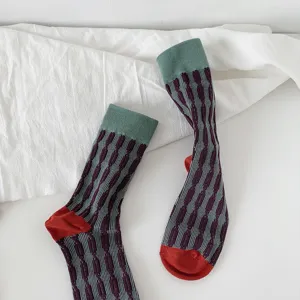 Detailed view of women's vintage color-blocked mid-calf knit socks with unique texture.