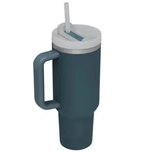 Stainless steel tumbler detail showing ergonomic handle and straw lid construction.