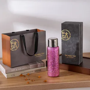 Coffret cadeau bouteille isotherme en titane de luxe avec design scintillant élégant.