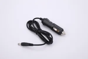 Detail view of black car cigarette lighter adapter cable with DC plug for vehicle electronics.