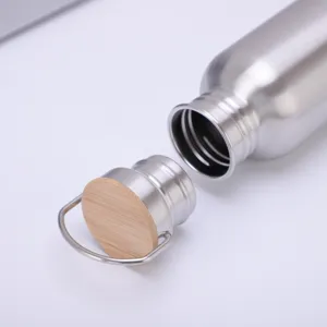 Stainless steel sports water bottle with bamboo lid and handle, close-up product detail.