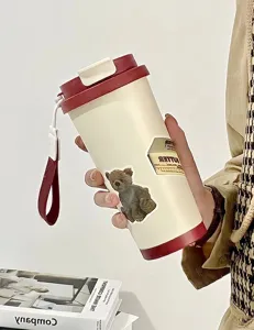 Insulated stainless steel tumbler with cute bear sticker, portable rope and red lid for daily use.