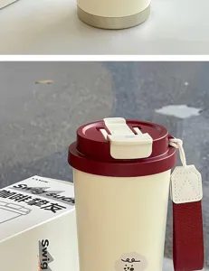 Stainless steel insulated coffee tumbler with dual drinking lid and cute bear strap.