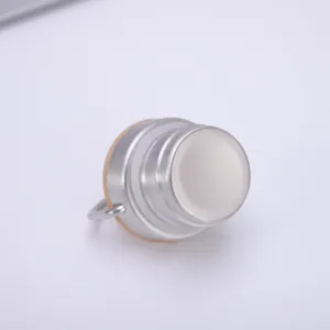 Stainless steel water bottle cap detail view showing metal handle and thread structure.