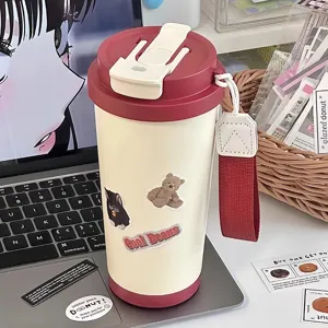 Stainless steel insulated travel mug with straw and lid, large capacity cute water bottle.