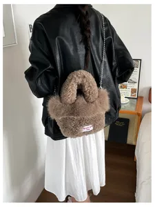 Cozy brown fluffy crossbody bag with metal chain strap, cute winter fashion handbag for women.