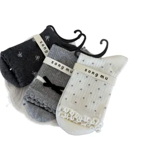 Songmu designer bow mid-calf socks for women, cute knit hosiery with sweet ruffles.