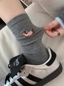Grey striped mid-calf socks for women featuring cute dachshund embroidery, soft cotton wear.