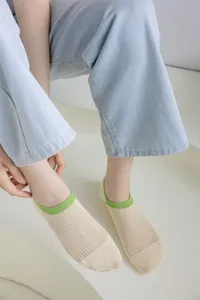 Summer cotton invisible socks for women, low-cut boat socks with contrast green cuffs.