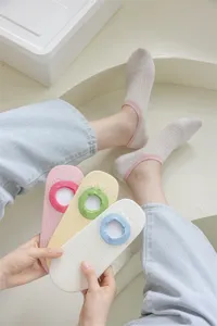 Detail view of summer thin low cut invisible boat socks with silicone grip and color block design.