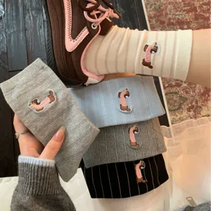 Cute cotton women mid-tube socks featuring cute embroidered dachshund and striped design.