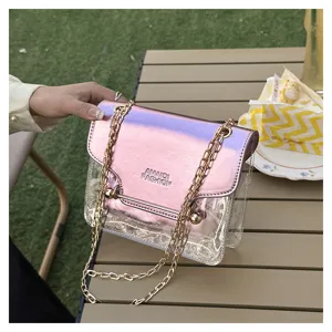 Transparent pink metallic chain crossbody bag detail, stylish clear small square shoulder bag.