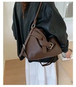 Dark brown PU leather crossbody bag with stylish knot design, retro motorcycle shoulder tote.