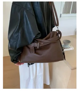 Brown leather shoulder bag, vintage motorcycle style tote, slouchy design for daily commute.