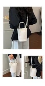 Stylish white woven bucket bag for women, chic shoulder handbag with large capacity.