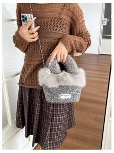Detailed view of the trendy fluffy plush handbag featuring soft shearling fabric and stylish chain.