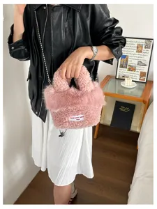 Chic fluffy plush handbag for women, cute furry crossbody bag with metal chain strap and tag.
