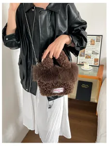 Chic brown fluffy crossbody bag for women, versatile plush handbag with chain strap style.