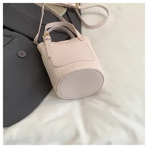 Pink woven bucket bag stylish shoulder crossbody purse for women elegant daily handbag chic design