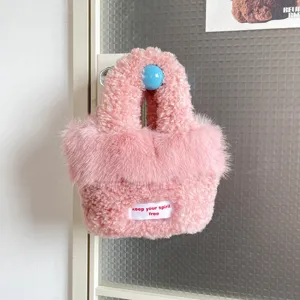 Cute pink fluffy faux fur handbag for women, chic niche design top handle shoulder bag.